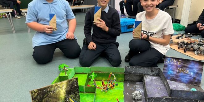 Hebrew school students use coding and math skills to navigate robot through maze