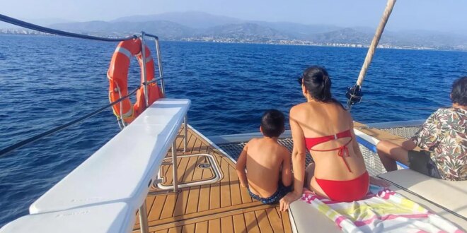 Dolphin spotting and open sea swimming from catamaran based in popular Costa del Sol harbour