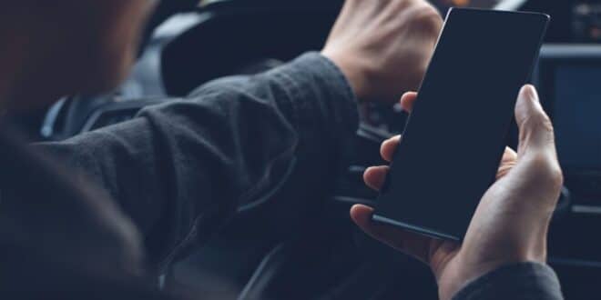 California bans holding phones while driving