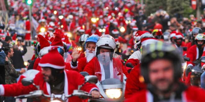 Santa’s coming to town on a Harley! Motorbike clubs don Santa outfits for the annual “Papanoelada” toy run