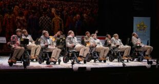 WATCH: Bizarre moment carnival group in wheelchairs parades as Stephen Hawking in southern Spain – before belting out songs dedicated to late physicist