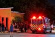 An ambulance outside an orange building