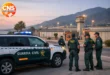 Guardia Civil officers and patrol vehicle outside Alhaurín de la Torre prison in Málaga.