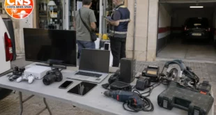 Seized electronics and tools outside an Almería shop