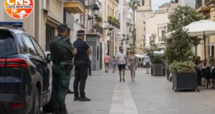 Police presence on a quiet street in Oliva, Valencia