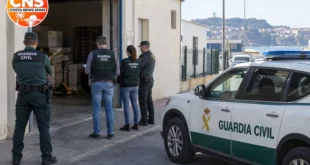 Guardia Civil officers outside a warehouse in Ceuta
