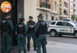 Guardia Civil officers outside an apartment building in Valencia