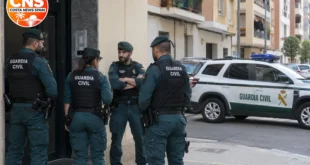 Guardia Civil officers outside an apartment building in Valencia