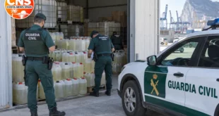 Guardia Civil officers inspect seized fuel containers in Algeciras