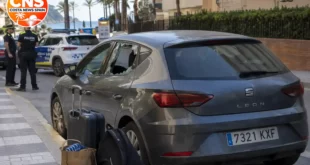 Broken hire car window on a street in Lloret de Mar