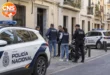 Policia Nacional officers outside a Malaga city centre building