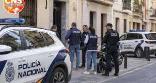 Policia Nacional officers outside a Malaga city centre building