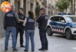 Police officers outside closed shops during Blocus probe