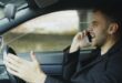 A man on a mobile phone while driving