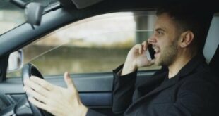 A man on a mobile phone while driving